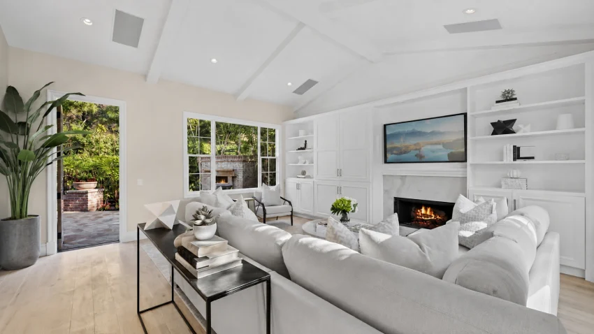 Luxury interior of the Kobe Bryant house with Mediterranean architecture, limestone flooring, walnut finishes, and spacious family living areas.
