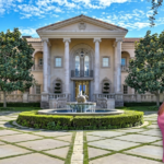Aerial view of Britney Spears house in Calabasas, California, surrounded by lush landscaping and gated community walls.