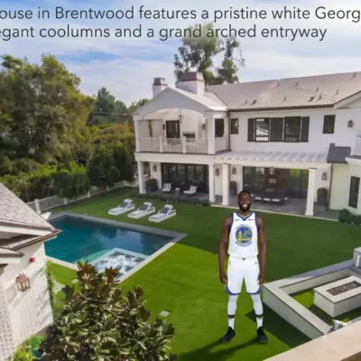 Modern exterior view of the Draymond Green House featuring luxury architecture, large glass windows, and elegant landscaping.