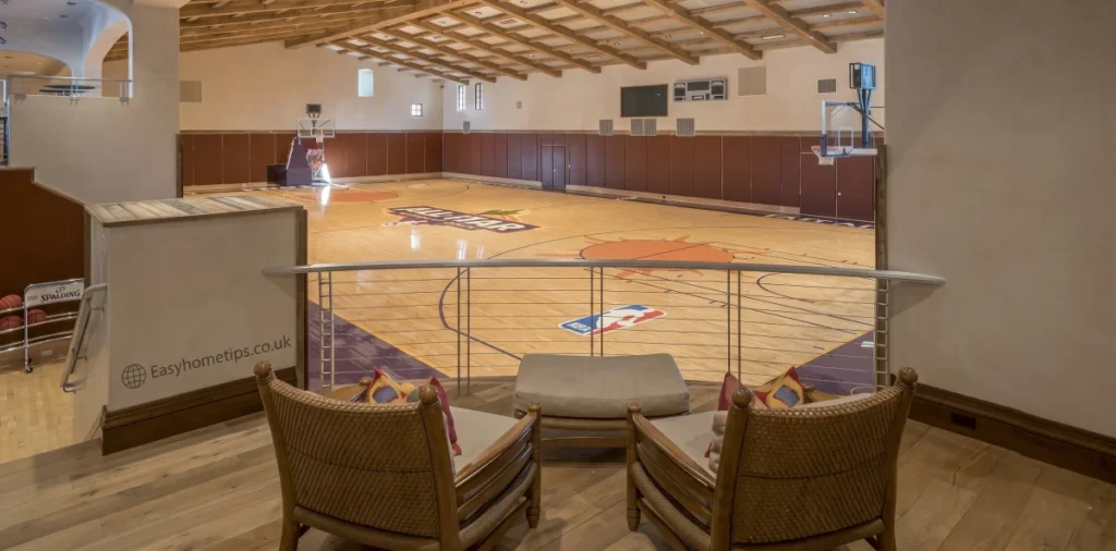 Modern luxury house exterior with sleek glass walls. Does the Anthony Edwards house have a basketball court? Find out.