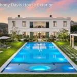 A view of the luxury Anthony Davis house in Bel-Air featuring large windows.