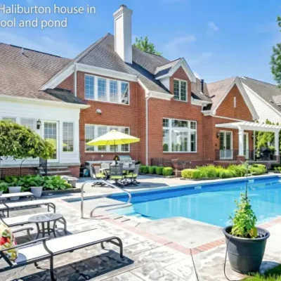 Exterior view of the Tyrese Haliburton house in Carmel Indianapolis with pool and pond