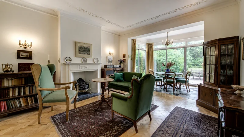 Inside the Emma Watson House featuring a modern luxury mansion exterior with elegant architecture and premium landscaping.