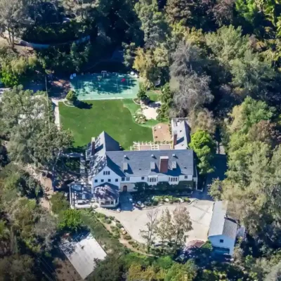 Exterior view of the Sandra Bullock house showing the wooded Beverly Hills estate